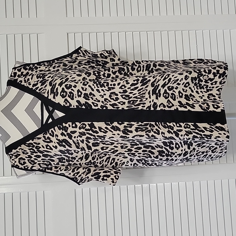 Chico's size 2 cream and black animal print open shoulder blouse.